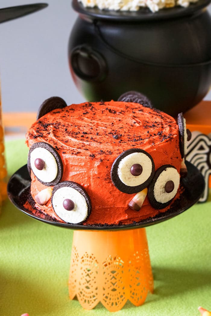 Halloween cake with candy eyes decoration on wooden table. Close up Stock  Photo