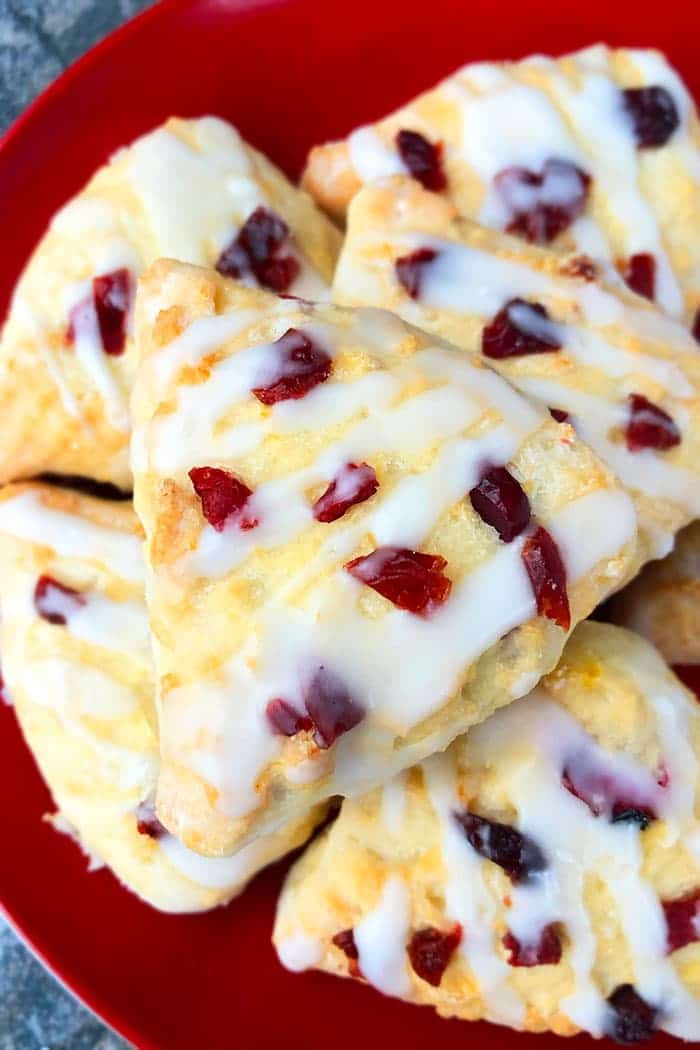 Stack of Homemade Cranberry Scones on a Red Plate