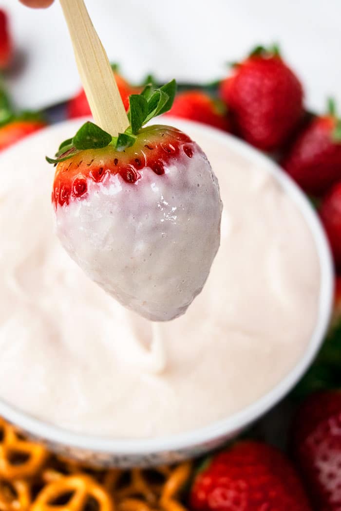 Best Marshmallow Fruit Dip in White Bowl With Closeup Shot of Dipped Strawberry 