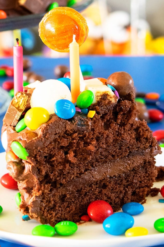 Slice of Homemade Birthday Cake on White Dish. 