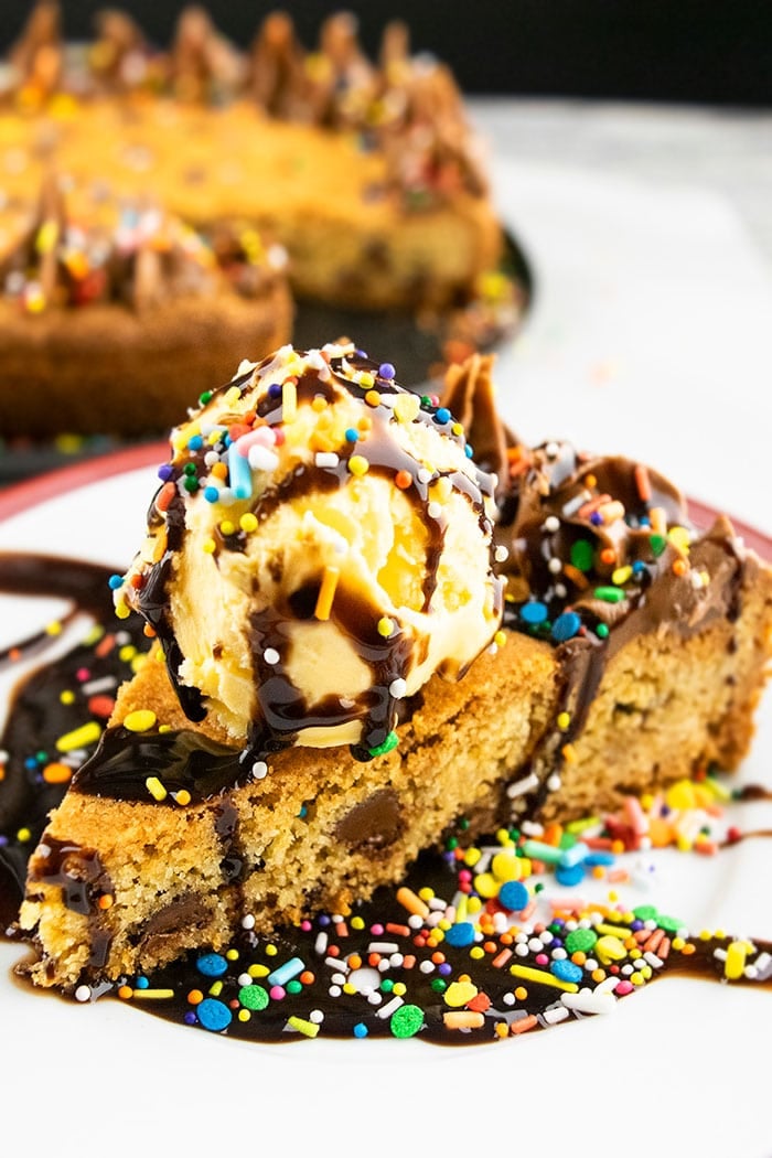 Cookie Cake Slice with Scoop of Ice Cream, Sprinkles and Chocolate Fudge Sauce
