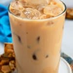 Iced Vanilla Latte in a Clear Glass on a Plate with Cookies