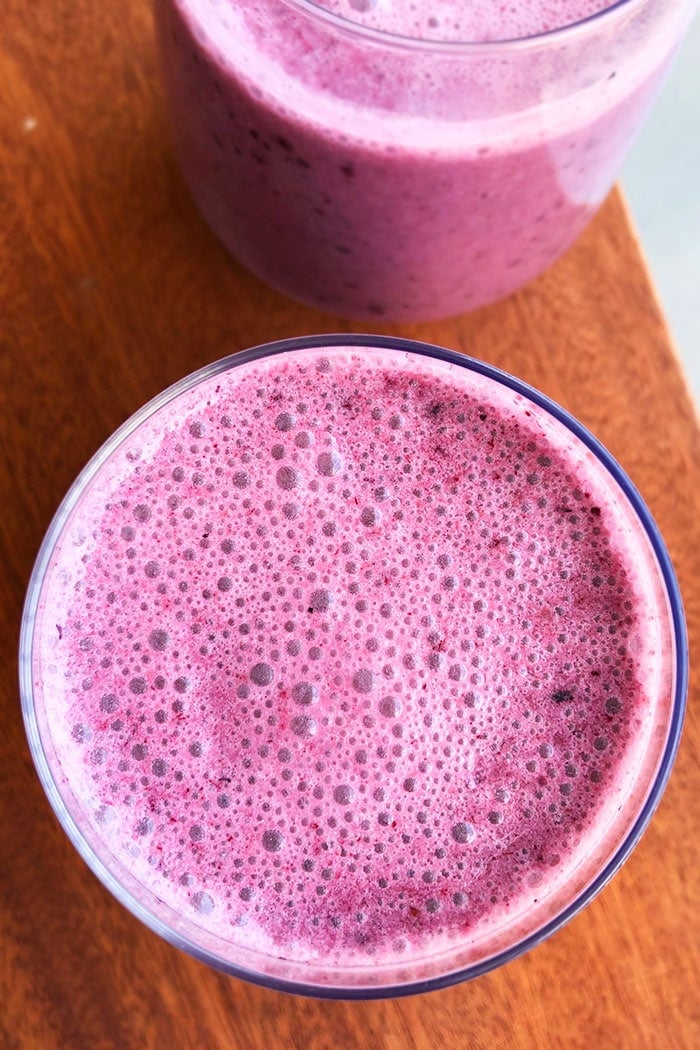 Overhead Shot of Blueberry Banana Smoothie in Clear Cup