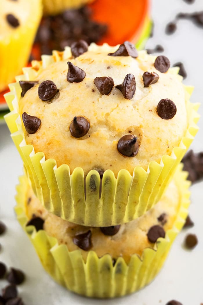 Stack of two Homemade Chocolate Chip Muffins on a White Board