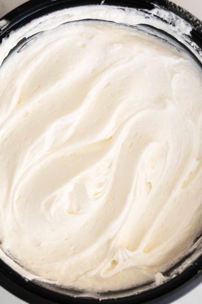 Easy Cinnamon Roll Frosting in Black Bowl 