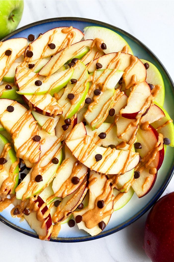 Easy Apple Nachos with Peanut Butter and Chocolate Chips in Blue Plate 