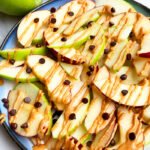 Easy Homemade Apple Nachos with Peanut Butter, Almond butter and Chocolate Chips in Blue Plate