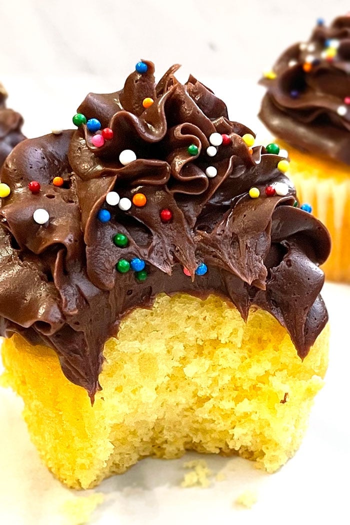 Best Homemade Yellow Cupcakes with Chocolate Icing- A bite Removed