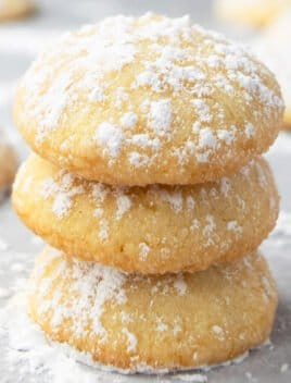 Stack of Easy Homemade Cream Cheese Cookies on Parchment Paper