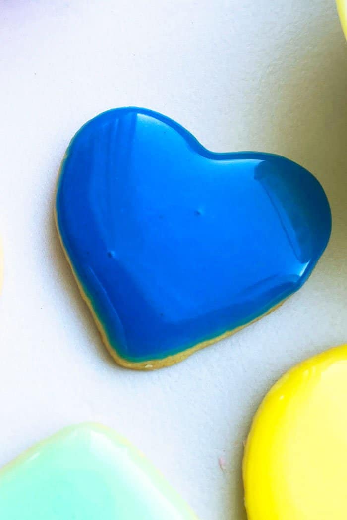 Easy Homemade Blue Glace Icing on Heart Cookie. 