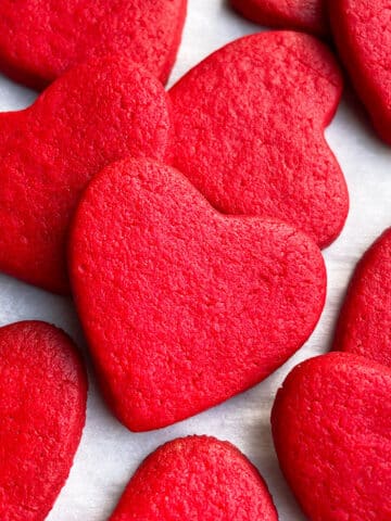Easy Valentine's Day Red Heart Cookies With Cake Mix on White Parchment Paper
