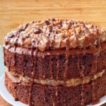 Easy Homemade German Chocolate Cake on White Plate With Wood Background