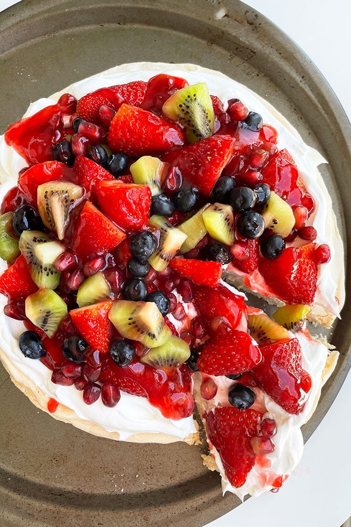 Round Meringue Dessert with a Slice Partially Removed- Overhead Shot