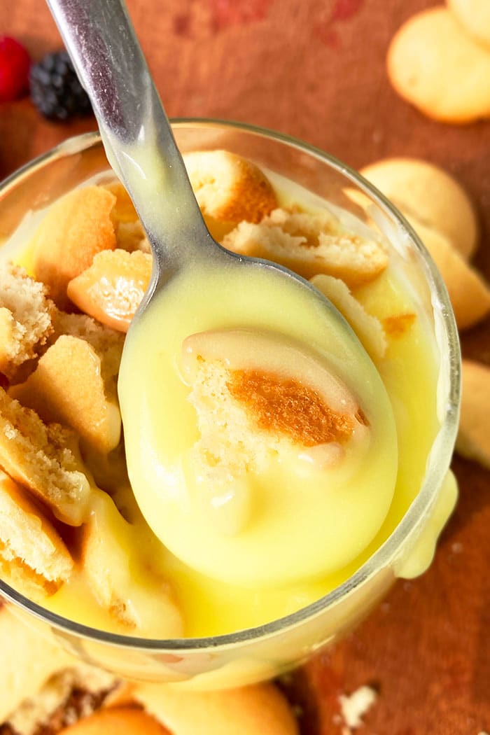 Spoonful of Best Old Fashioned Pudding with Vanilla Wafers Over Glass Cup