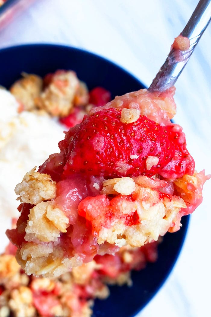 Spoonful of Homemade Strawberry Rhubarb Crumble- Closeup Shot