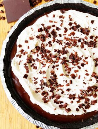 Easy No Bake Chocolate Cream Pie With Oreo Crust on Wood Background