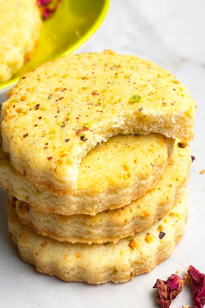 Stack of Homemade Pistachio Biscuits on White Background