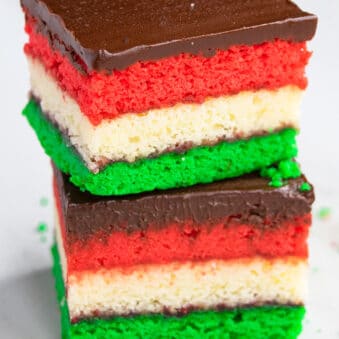 Stack of Easy Italian Rainbow Cookies (Or Venetians or Neapolitan cookies) on White Background