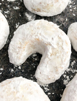 Classic Almond Crescent Cookies (Vanillekipferl) on Grayish Black Background- Overhead Shot