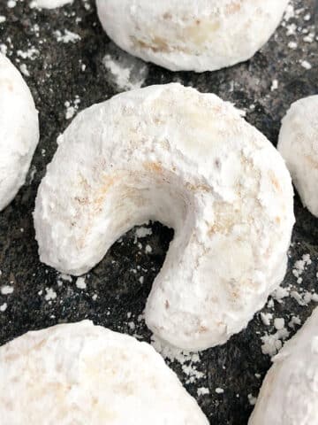 Classic Almond Crescent Cookies (Vanillekipferl) on Grayish Black Background- Overhead Shot