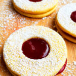 Easy Linzer Cookies Sandwiches With Raspberry Jam on Wood Background