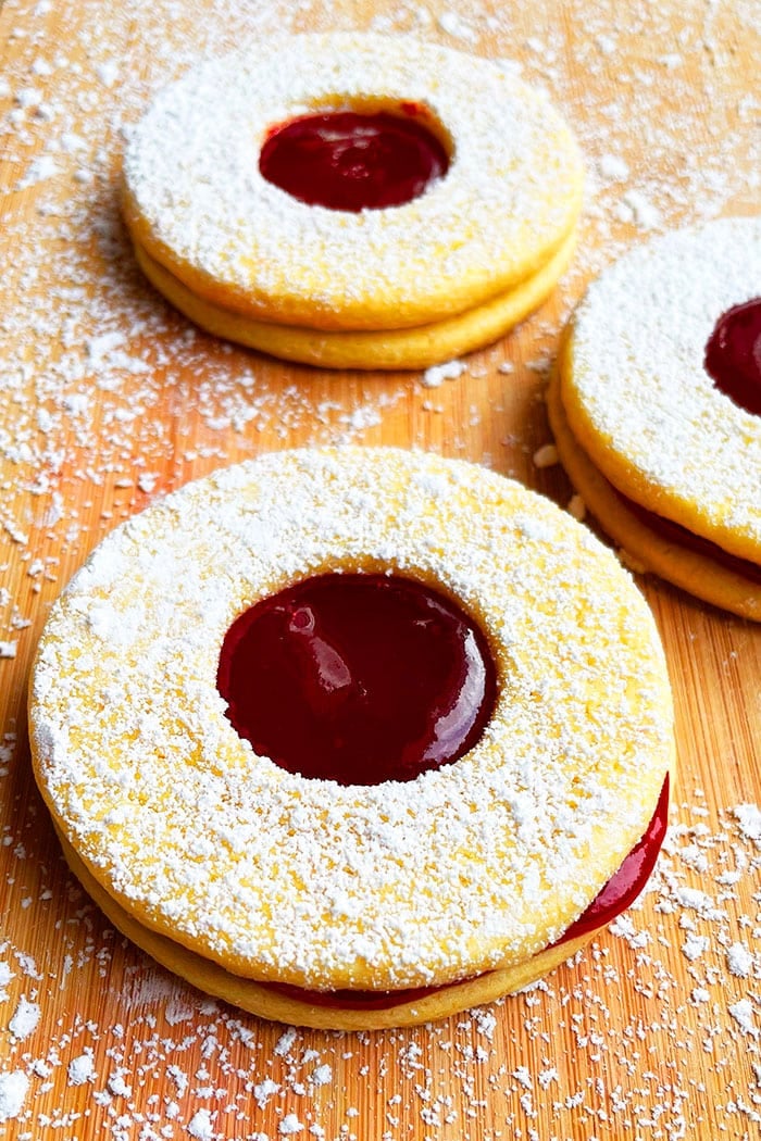 Easy Linzer Cookies With Raspberry Jam on Wood Background