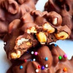 Easy Homemade Crockpot Candy (Chocolate Peanut Clusters) on White Parchment Paper