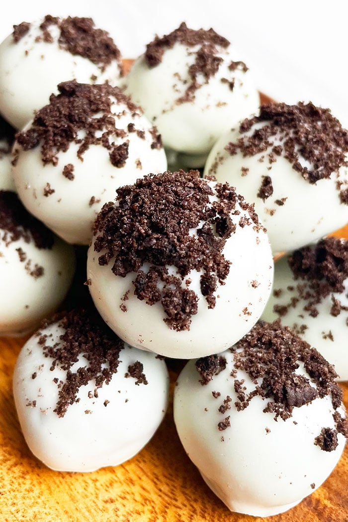 Stack of Oreo Truffles in a Wooden Plate