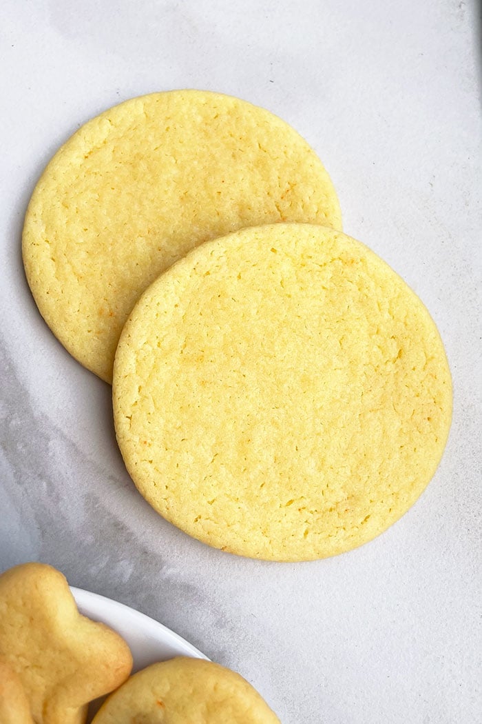 Two Round Cut Out Cookies on White Background