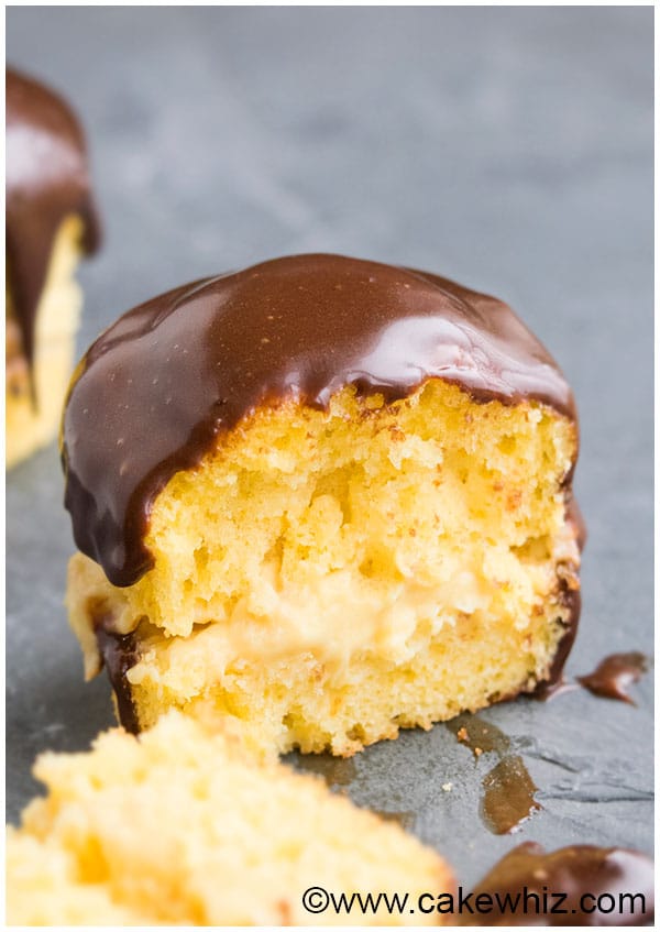 Boston Cream Pie Cupcakes Filled With Custard or Vanilla Pudding on Gray Background