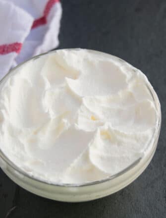 Easy Homemade Chantilly Cream (Creme Chantille) in Glass Bowl on Black Background