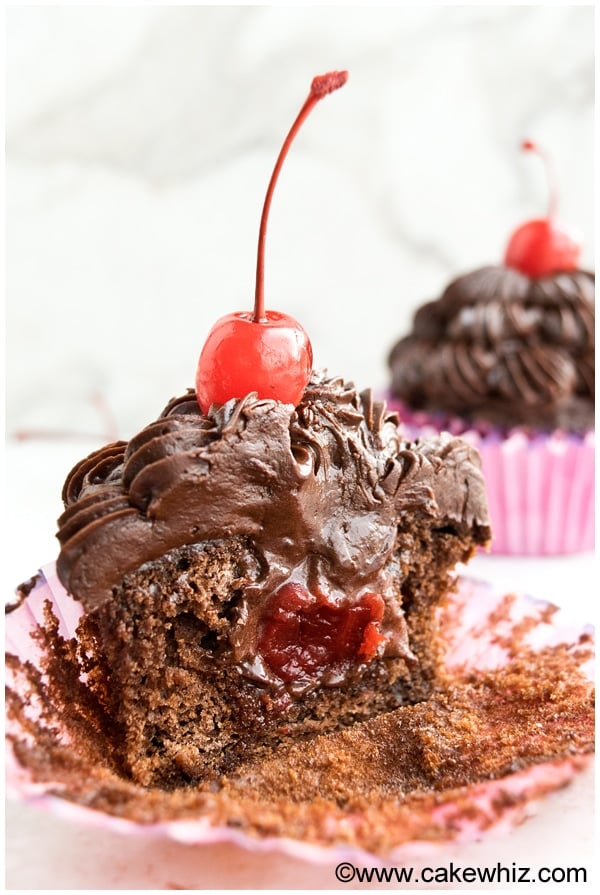 Chocolate Cupcakes Filled With Cherry Truffles on White Background