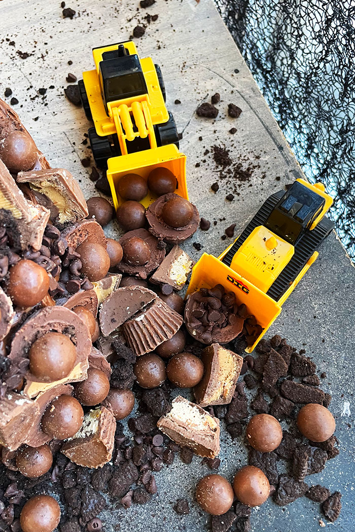 Construction Toys Scooping Up Chocolate Candies 