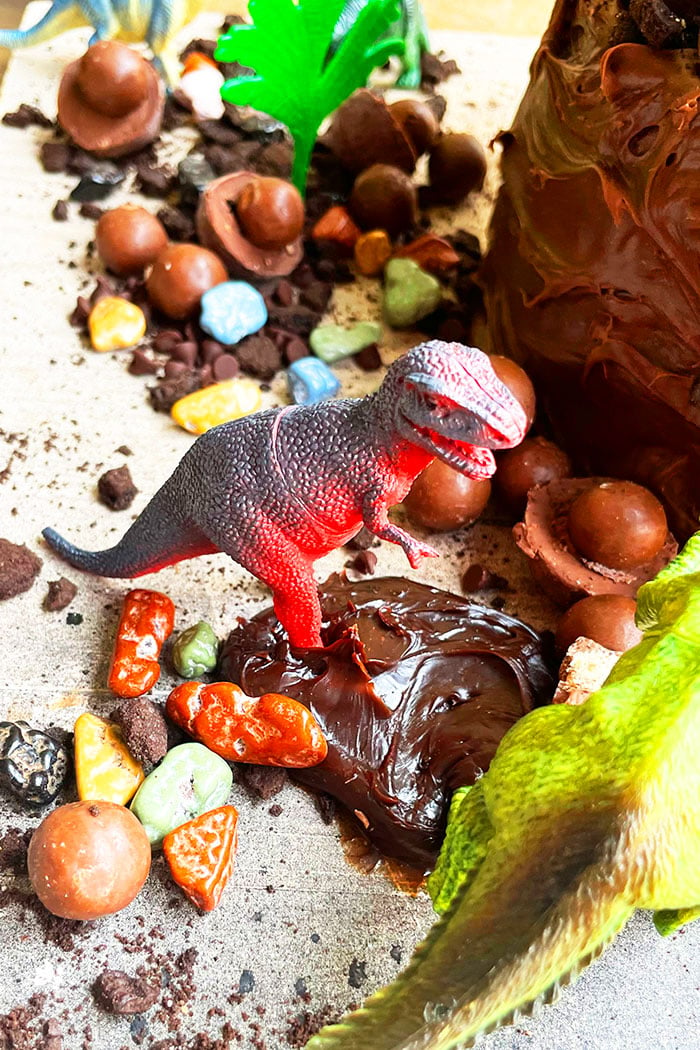 Dinosaur Toy in A Puddle of Chocolate Ganache