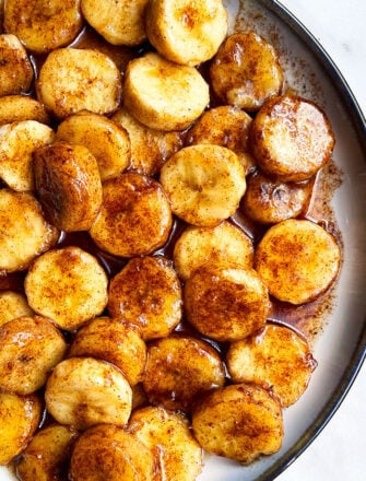 Easy Pan Fried Caramelized Bananas With Cinnamon Vanilla and Butter in White Dish