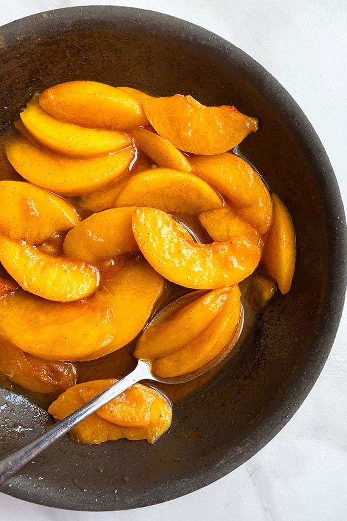 Stovetop Peaches in Brown Sugar Syrup in Nonstick Pan- Overhead Shot