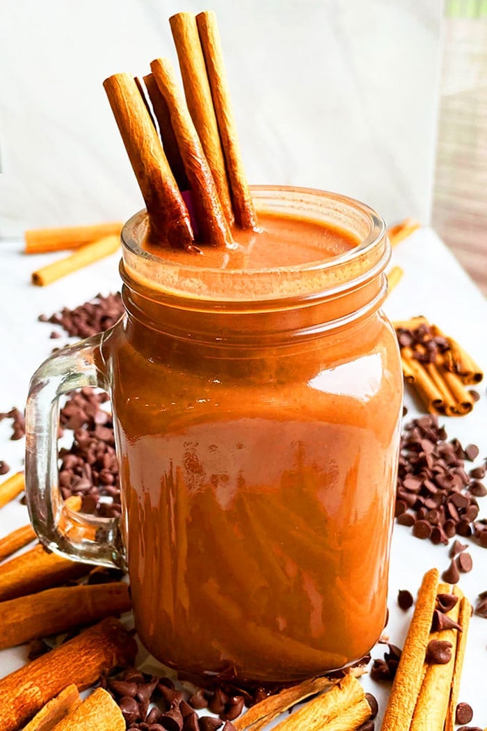 Spicy Mexican Hot Chocolate in Glass Mug With Cinnamon Sticks
