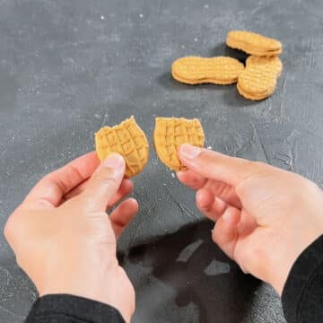 Nutter Butter cookie broken in half. 