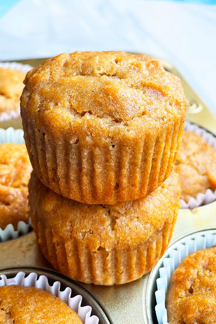 Stack of Easy Applesauce Muffins on Cupcake Pan