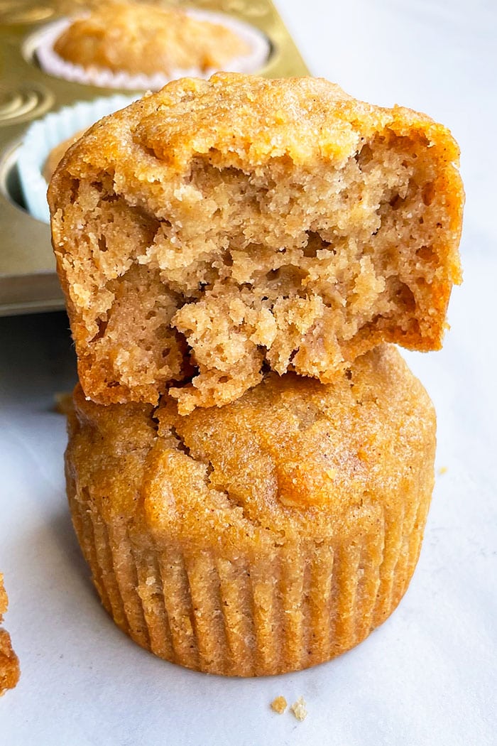 Partially Eaten Spice Muffin on Top of Whole Muffin- Closeup Shot