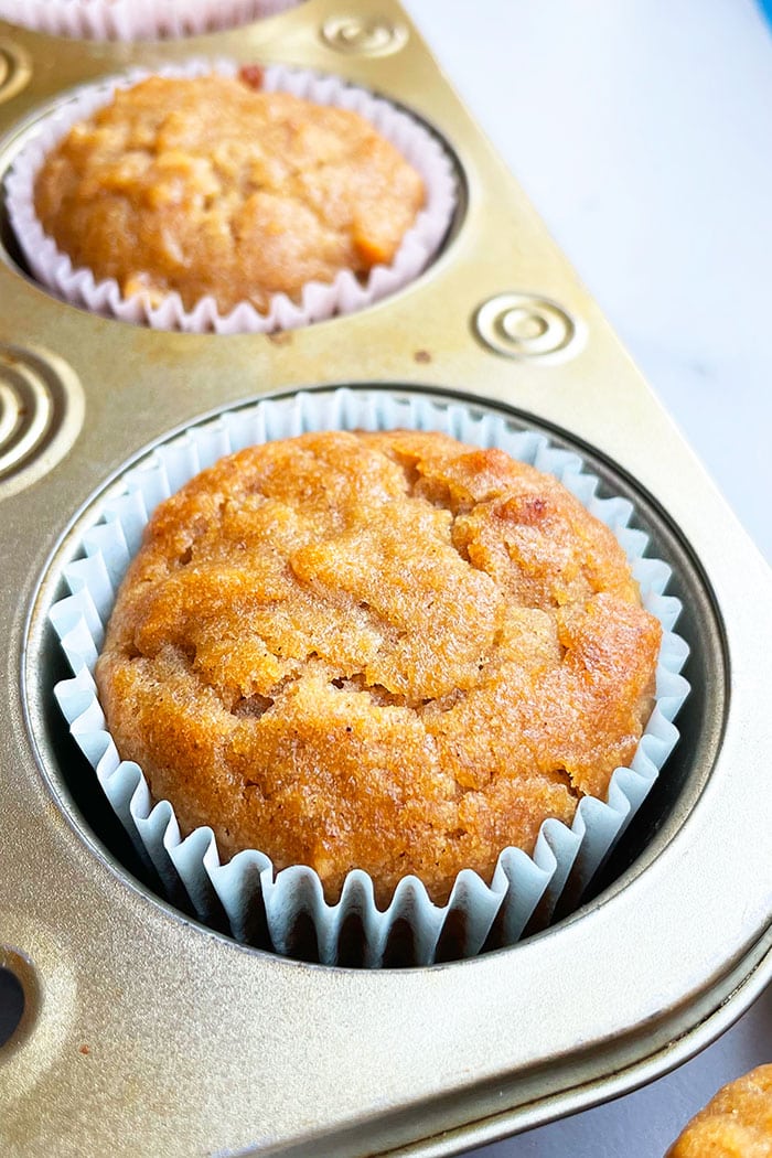 Freshly Baked Apple Muffin in Liner in Cupcake Pan