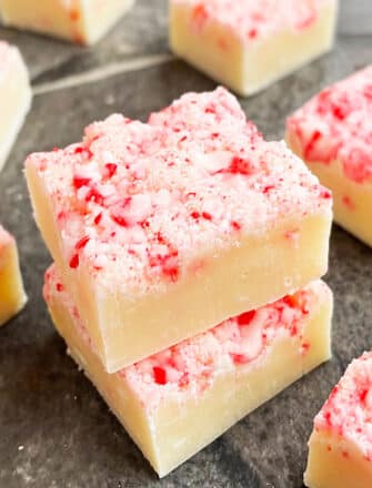 Stack of Easy Christmas Fudge (Candy Cane Fudge) on Gray Background
