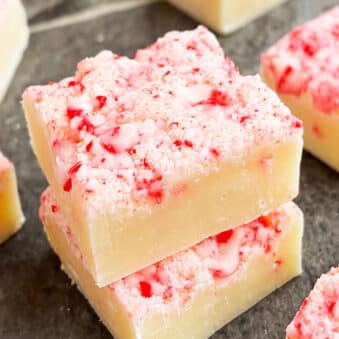 Stack of Easy Christmas Fudge (Candy Cane Fudge) on Gray Background