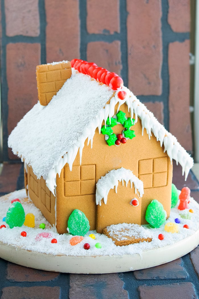 Easy Homemade Gingerbread House on Brick Background