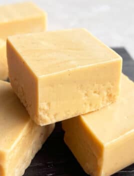 Stack of Easy Maple Fudge With Maple Syrup With Dull White Background