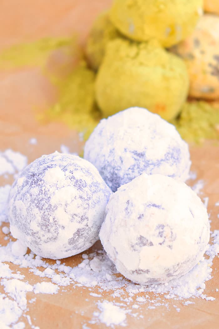 Truffle Balls Rolled in Powdered Sugar on Brown Paper