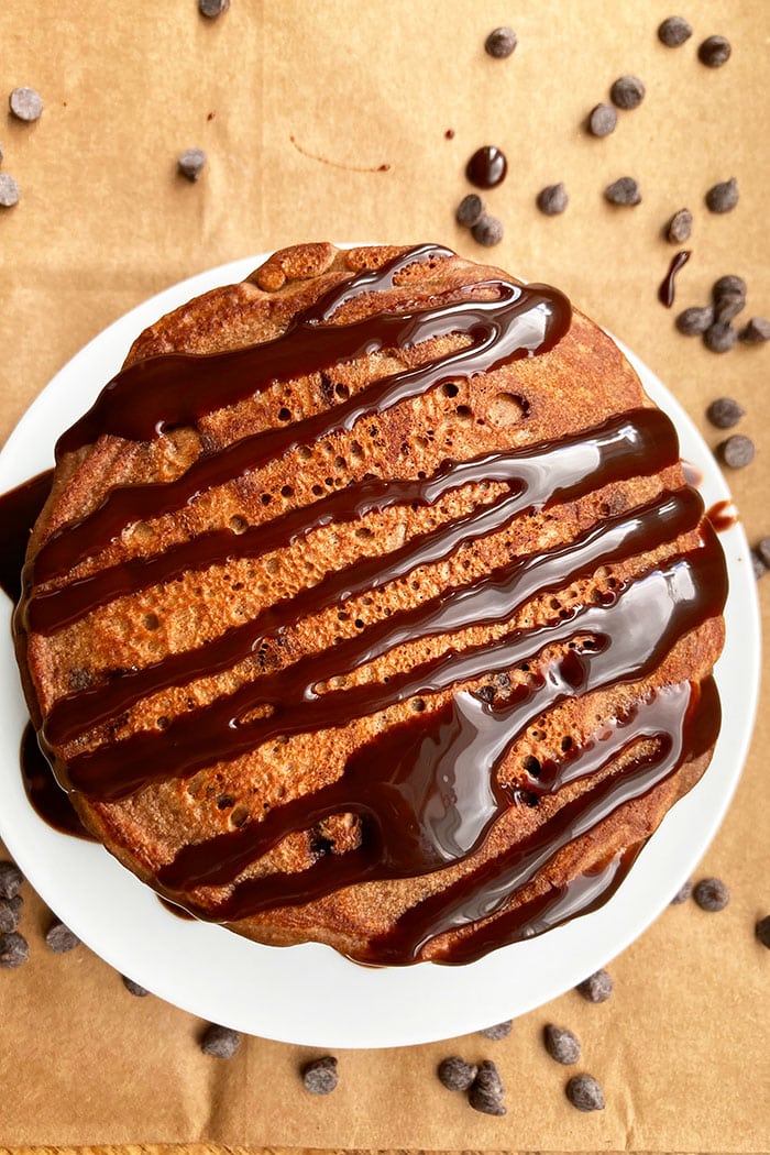 Brownie Pancakes With Chocolate Sauce on White Dish- Overhead Shot