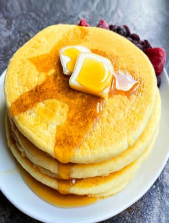 Easy Fluffy Buttermilk Pancakes Stacked in a White Dish