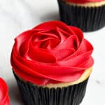 Easy Rose Cupcakes Piped With Red Buttercream Icing on White Background
