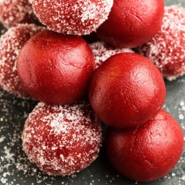 Stack of Easy Red Velvet Truffles With Cake Mix on Rustic Gray Background.